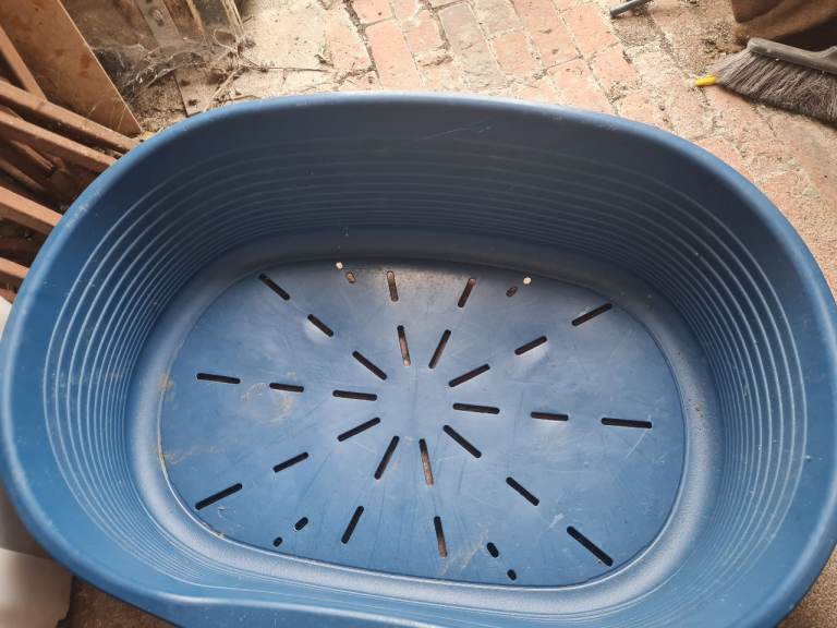 Large blue plastic dog bed 