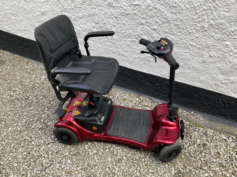 Red Ultra Lite CAR mobility scooter.