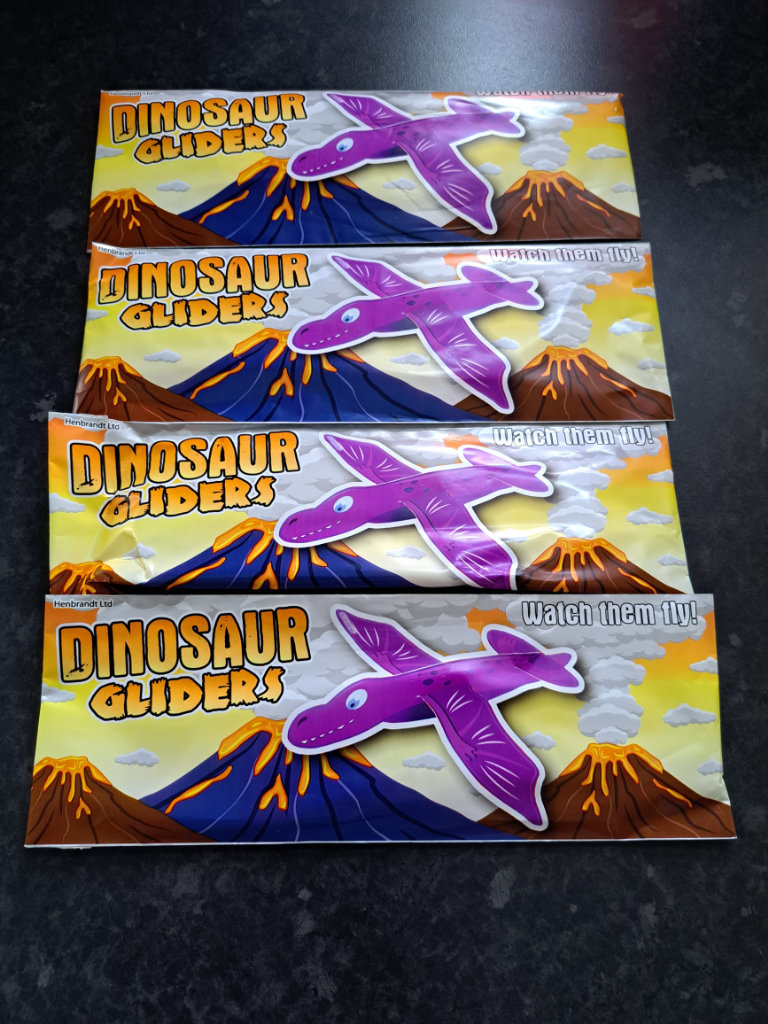 Brand new 4 purple dinosaur gliders 