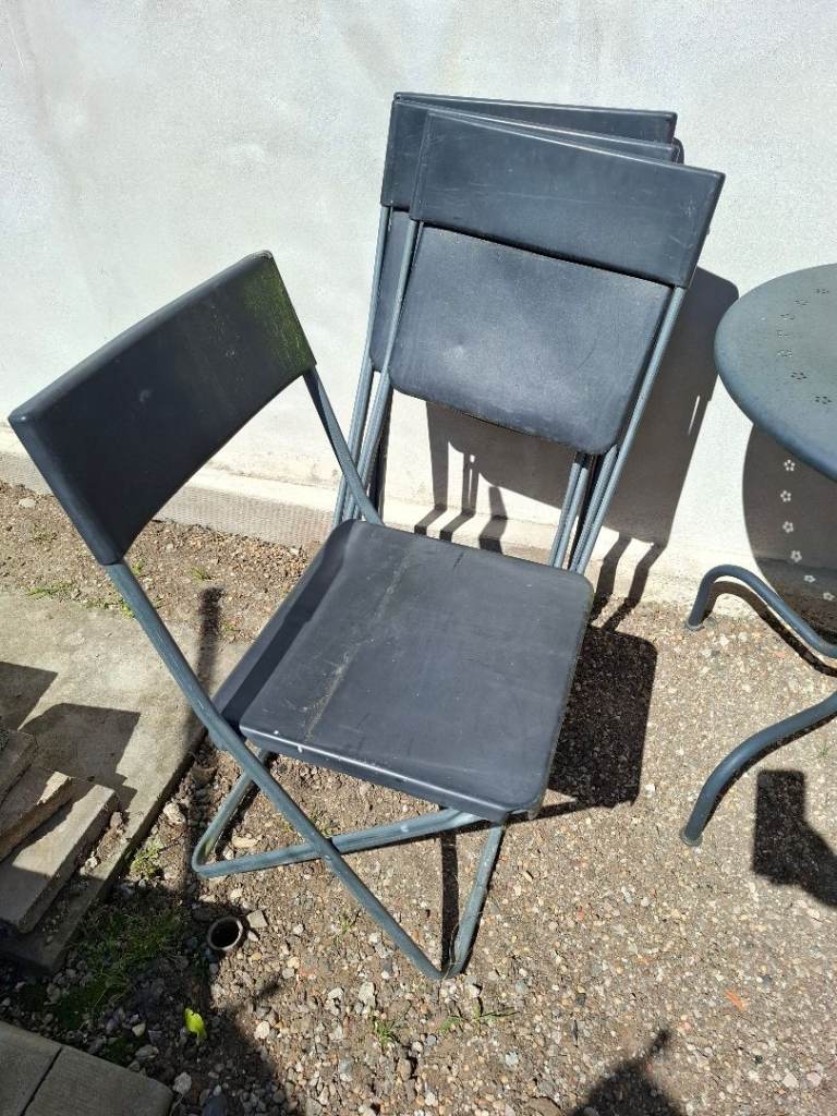 Four IKEA foldable chairs