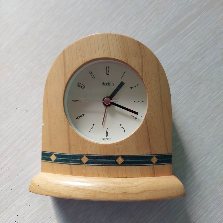 Small wooden clock in full working order