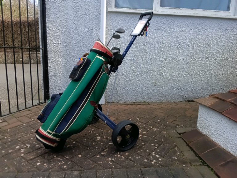 PROLINE Golf caddy and golf clubs and tees. 