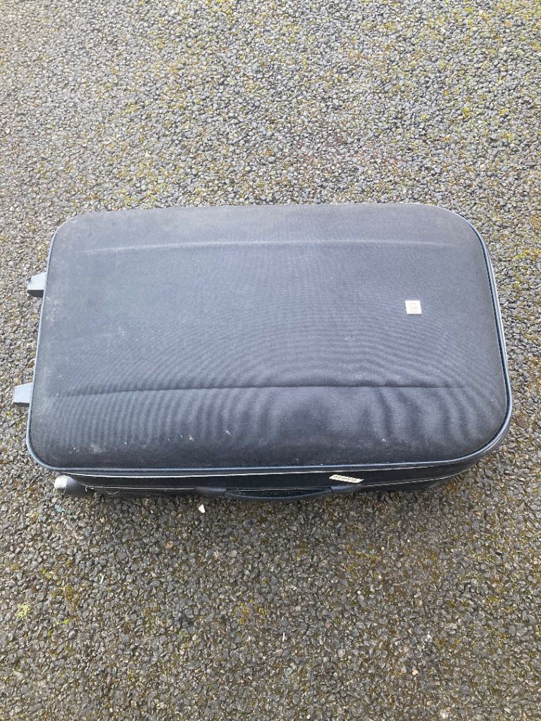 Suitcase wheels, handle. ~ 2.5ftx1ftx1ft