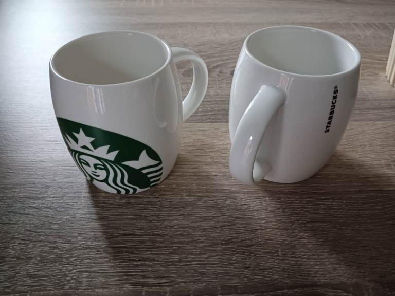 Pair of Starbucks mugs.