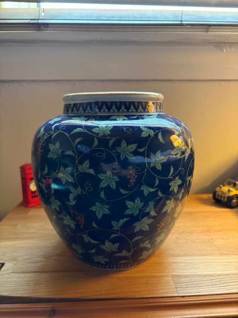Decorative Blue Ceramic Vase with Leaf and Grape Design