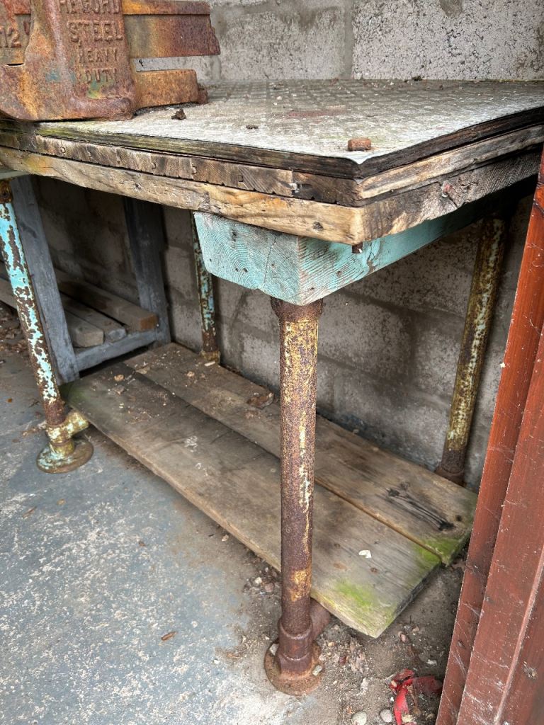 Handmade vintage sturdy workbench with big old metal vice 