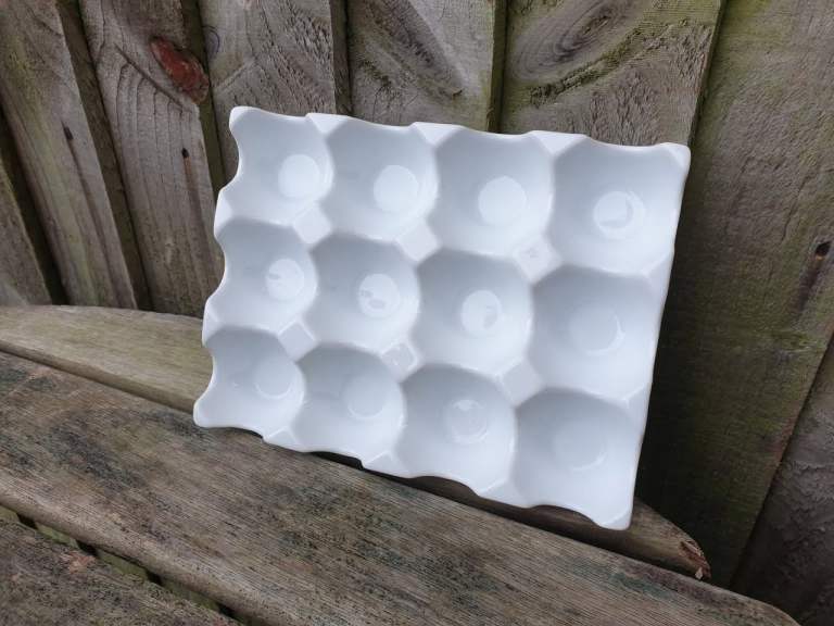 image for A white ceramic egg holder for 12/a dozen eggs, 
