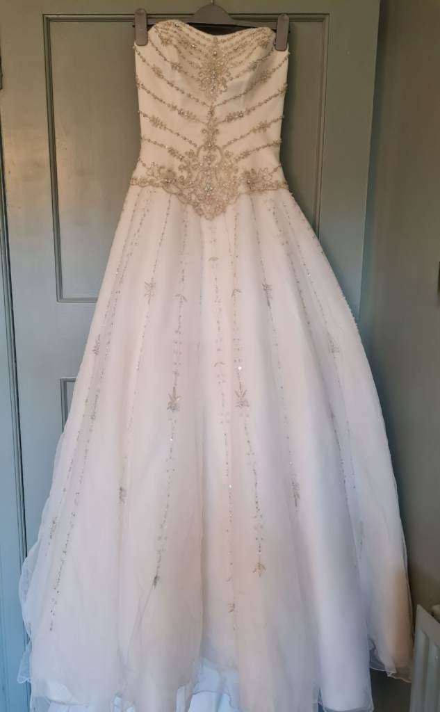 Stunning Ivory Wedding Dress with Beaded Bodice and Long Train