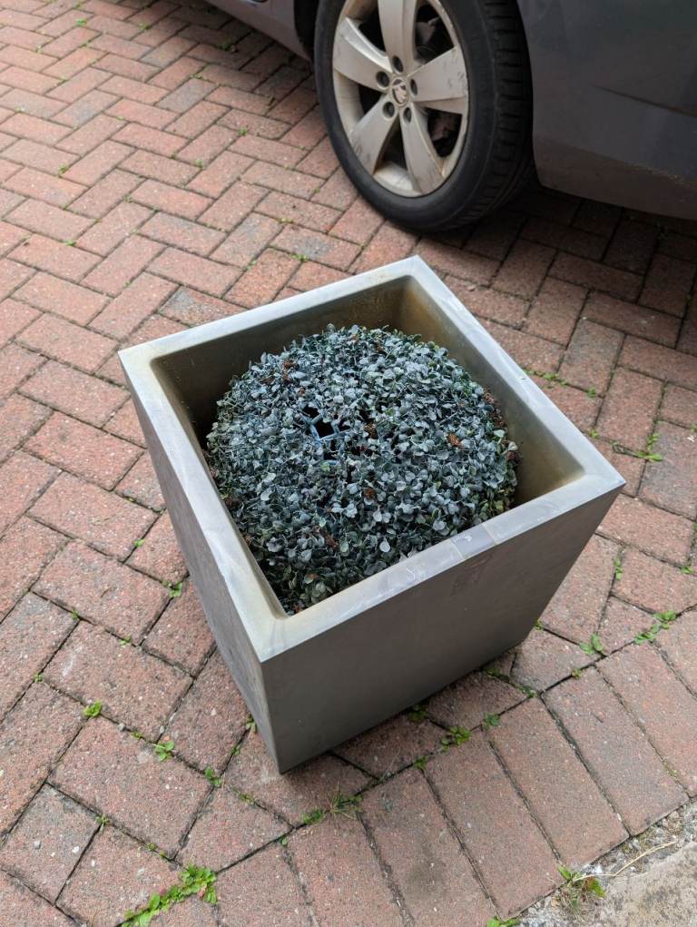 Selection of artificial plants and garden decor