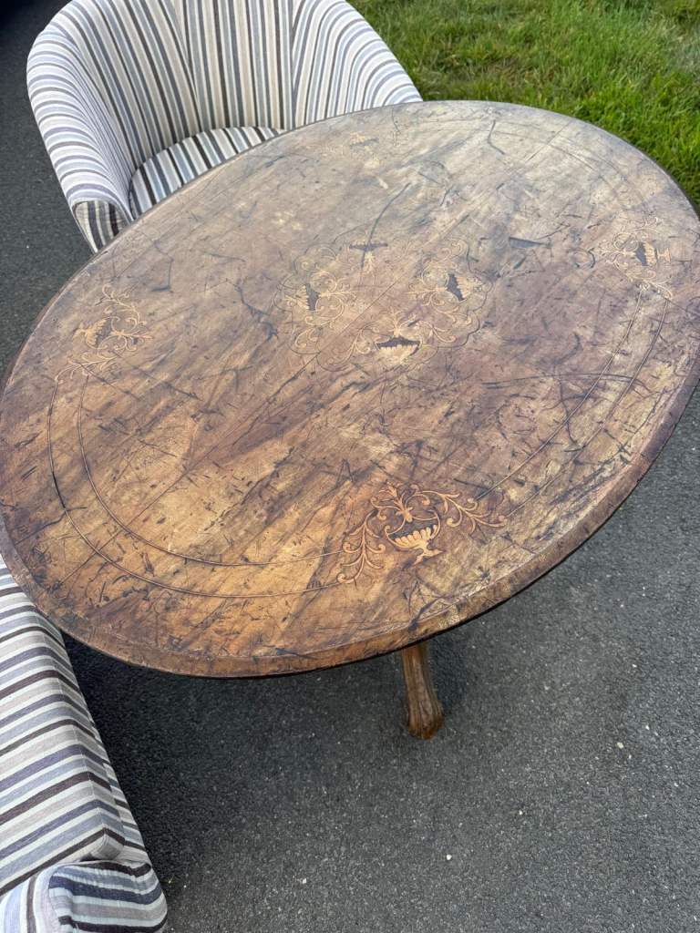 Oval wooden table with removable top