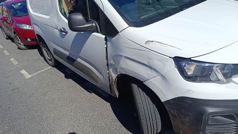 Genuine original OEM driver's side front right wing removed from a 2023 white Peugeot Partner van.