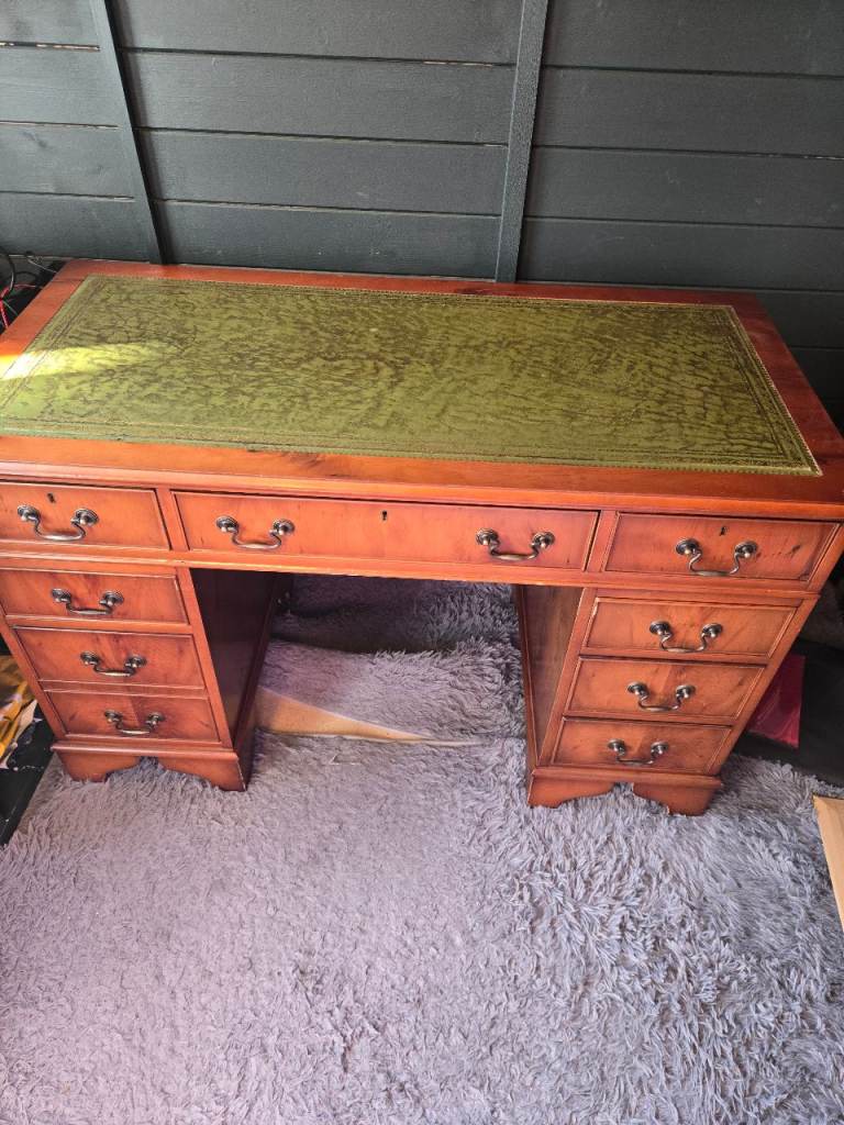 Vintage desk. Few age related scuffs but sturdy with great storage. Comes apart for transportation