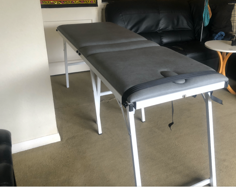 Portable massage table with cover