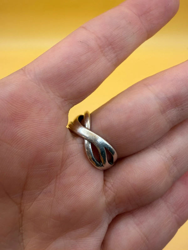 sterling silver wave ring features a distinctive intertwined design Uk ...