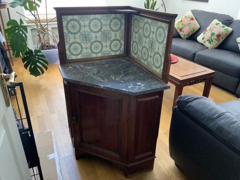 Beautiful old corner cupboard with marble and tiled top piece 
