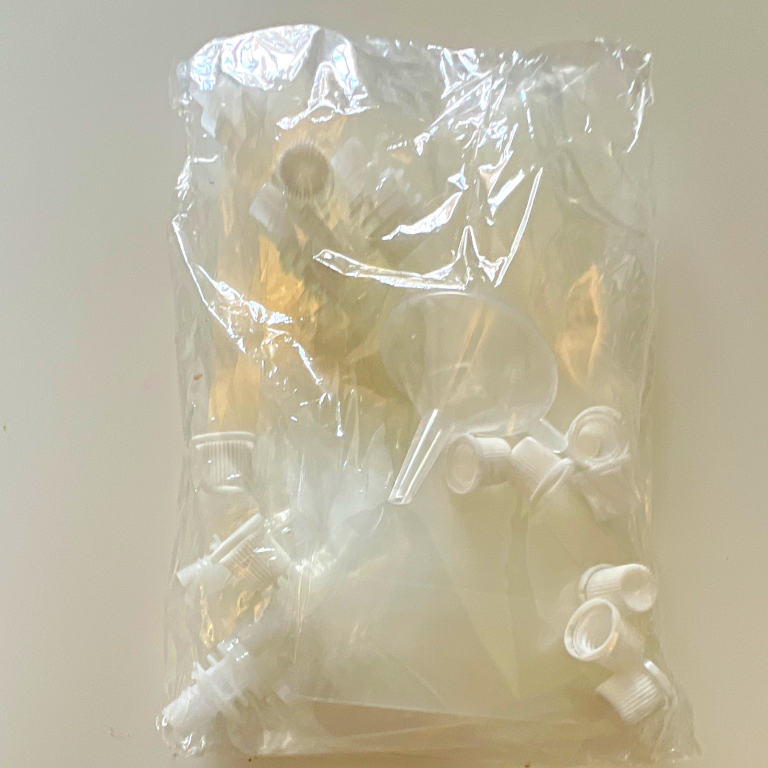 10 piece reusable transparent beverage bag. Screw cap. Includes funnel to fill