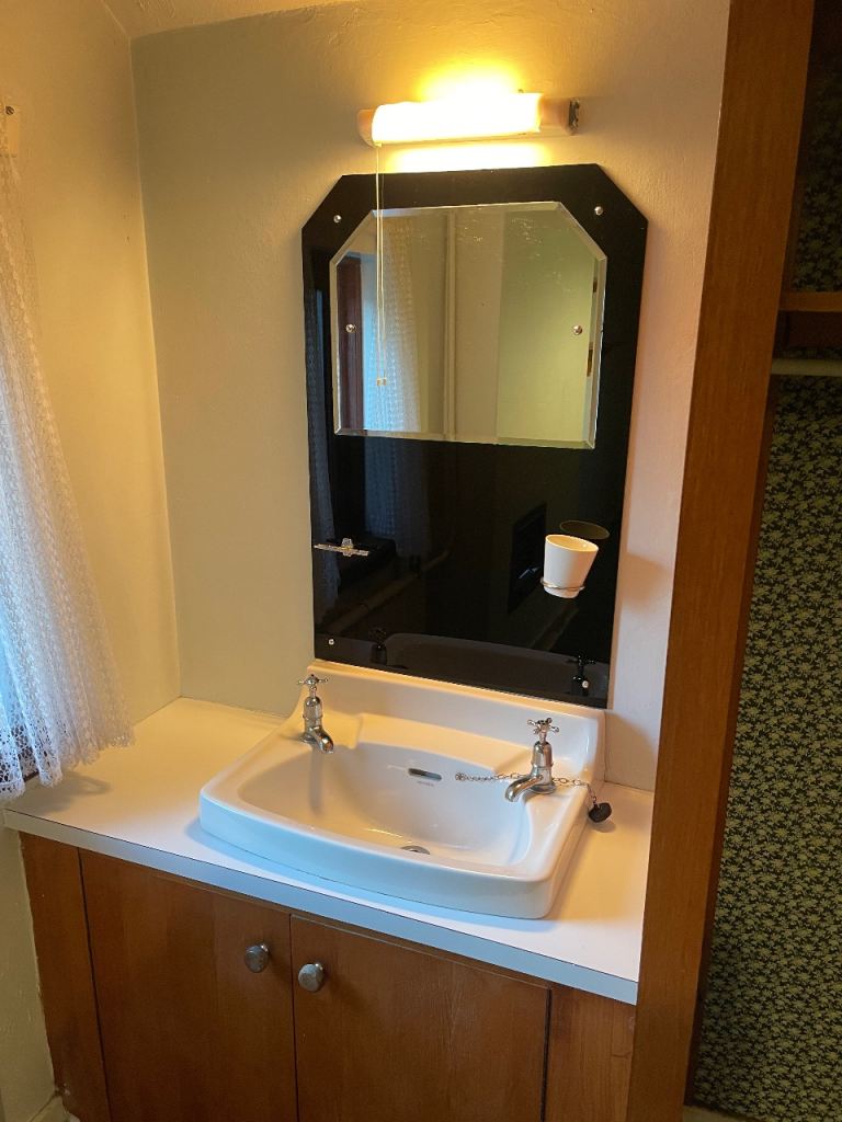 Art deco style vintage bathroom mirror and wash hand basin 