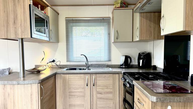 Own a caravan, repaying monthly, near Gt Yarmouth and Lowestoft