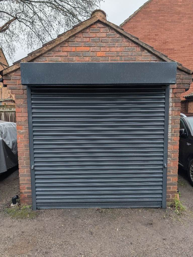 Large garage in secure parking lot with new door, Beckton