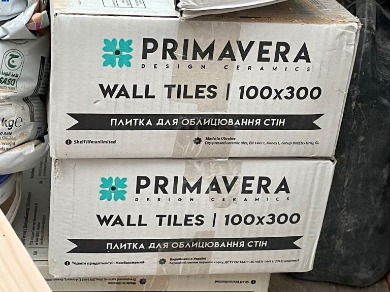 2 boxes of long format white wall tiles 