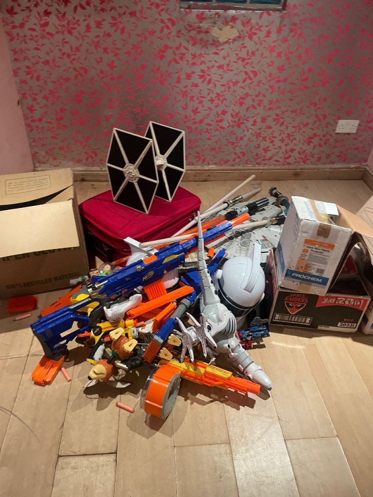 Assortment of starwars and Toy Story toys and nerf guns 