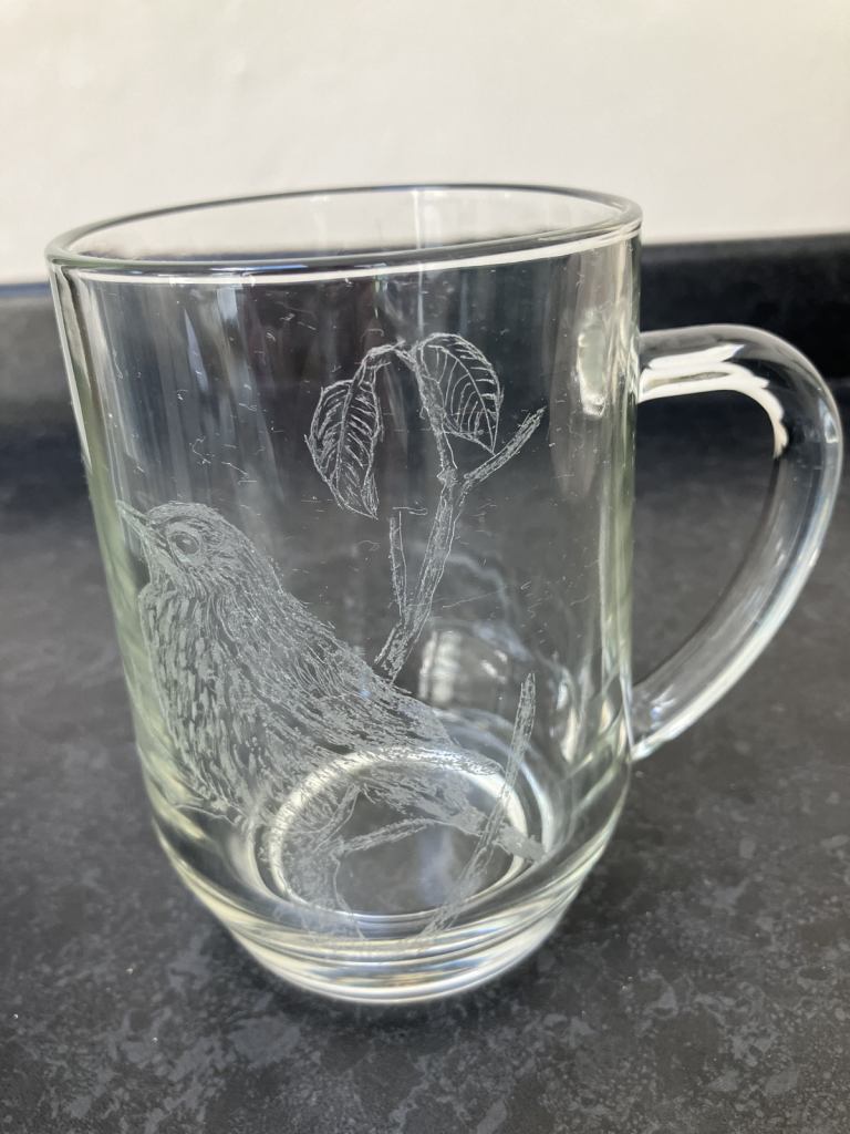 Engraved glass tankard with bird