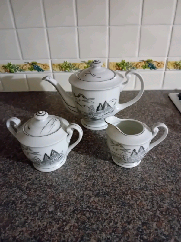 China tea pot sugar bowl and milk jug very good condition