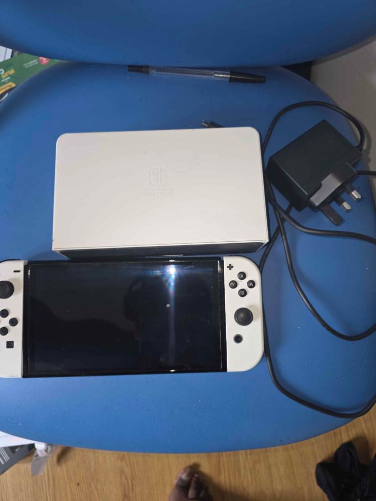Nintendo Switch OLED Console with Dock and Charger – Good Condition, Just dusty