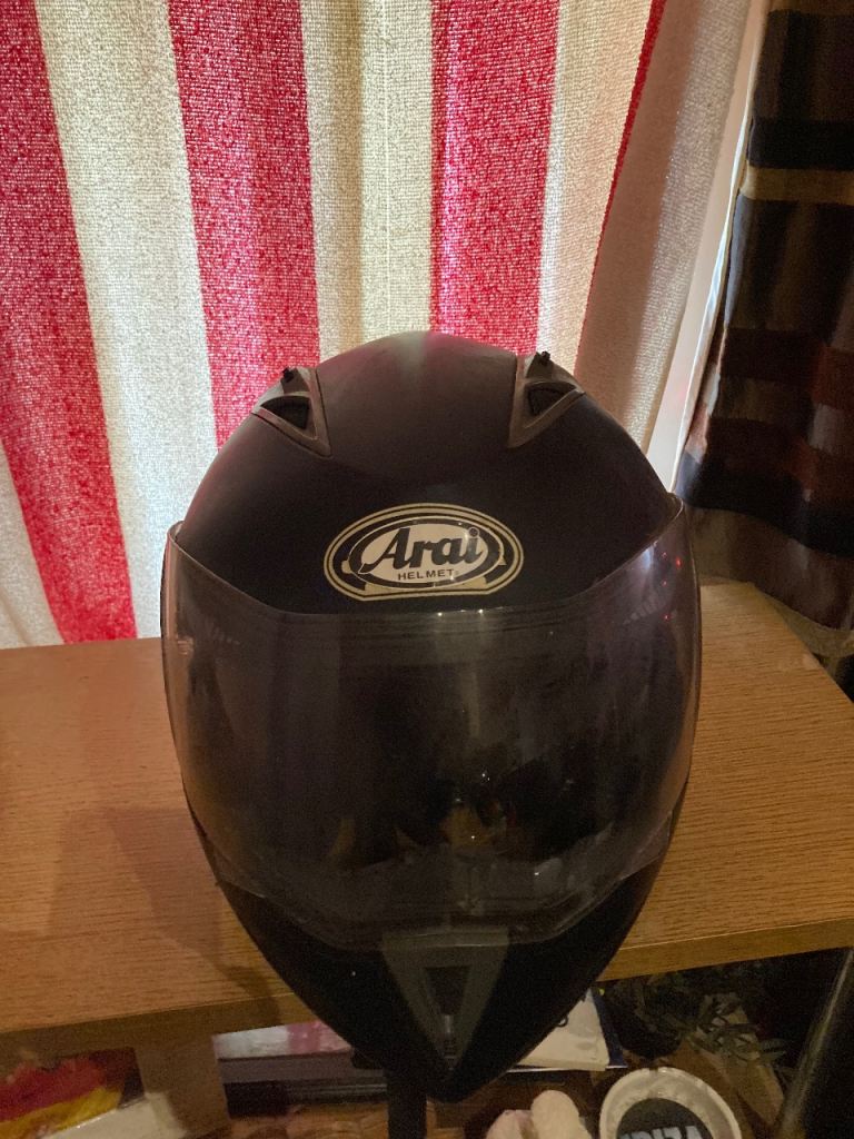 Flip up helmet with built in sun visor 