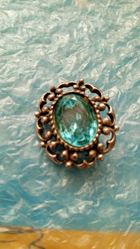 Antique brooch with stone in middle