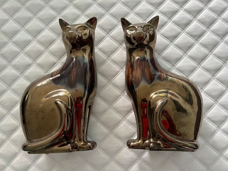 Poole pottery cats. 