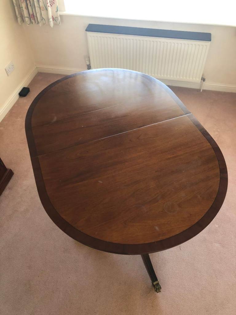 Extendable Dark Wood Oval Dining Table