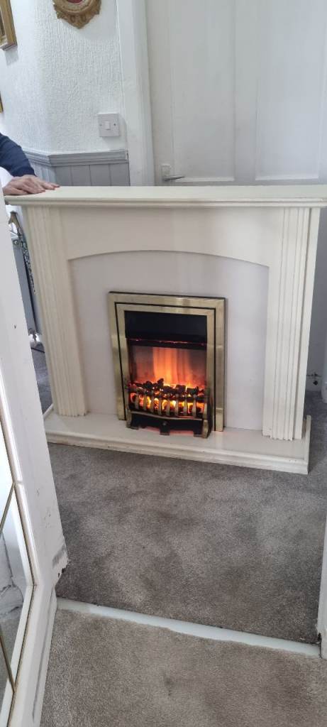 Sturdy fireplace and coal effect fire.