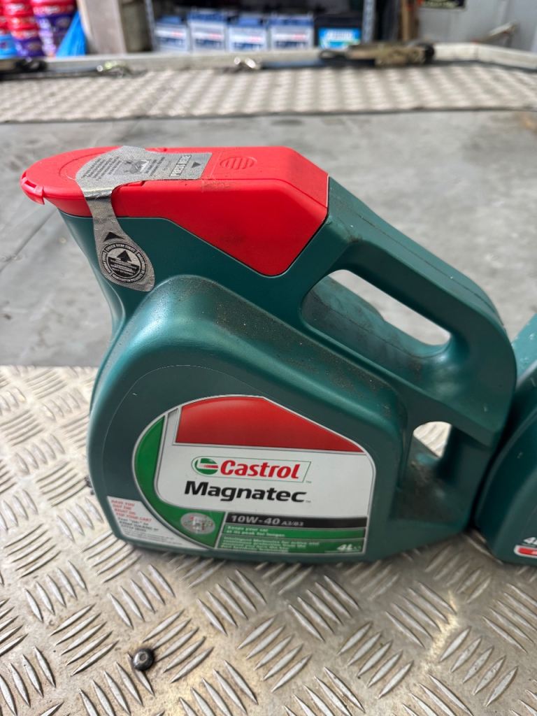 Castrol magnatec oil 1 full sealed 1 half full