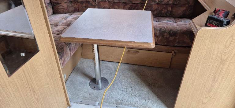 Table with leg in the floor mounted for caravan motorhome camper boat.