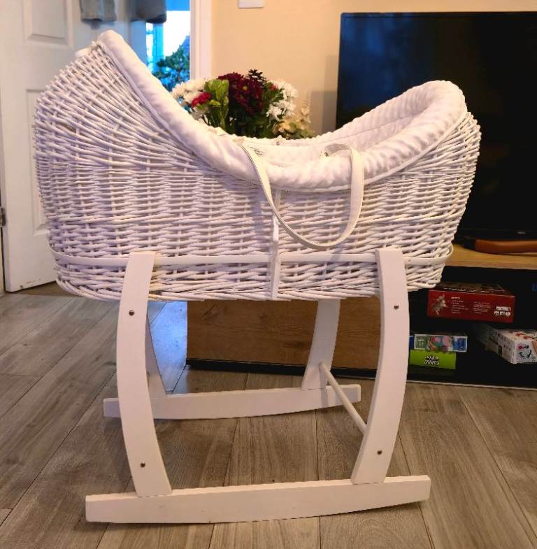 White basinet with matching mattress and blanket