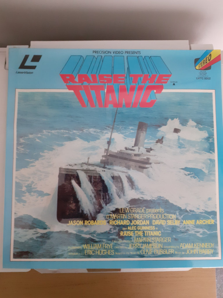 Video Laser Discs, 12 inch,  Airplane and Raise The Titanic. ( not dvds ).