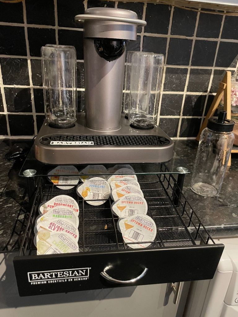 Cocktail maker BARTESIAN with stand and 13 cocktail pods included.