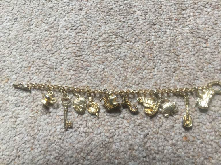 Vintage charm bracelet for a child in a gold coloured metal