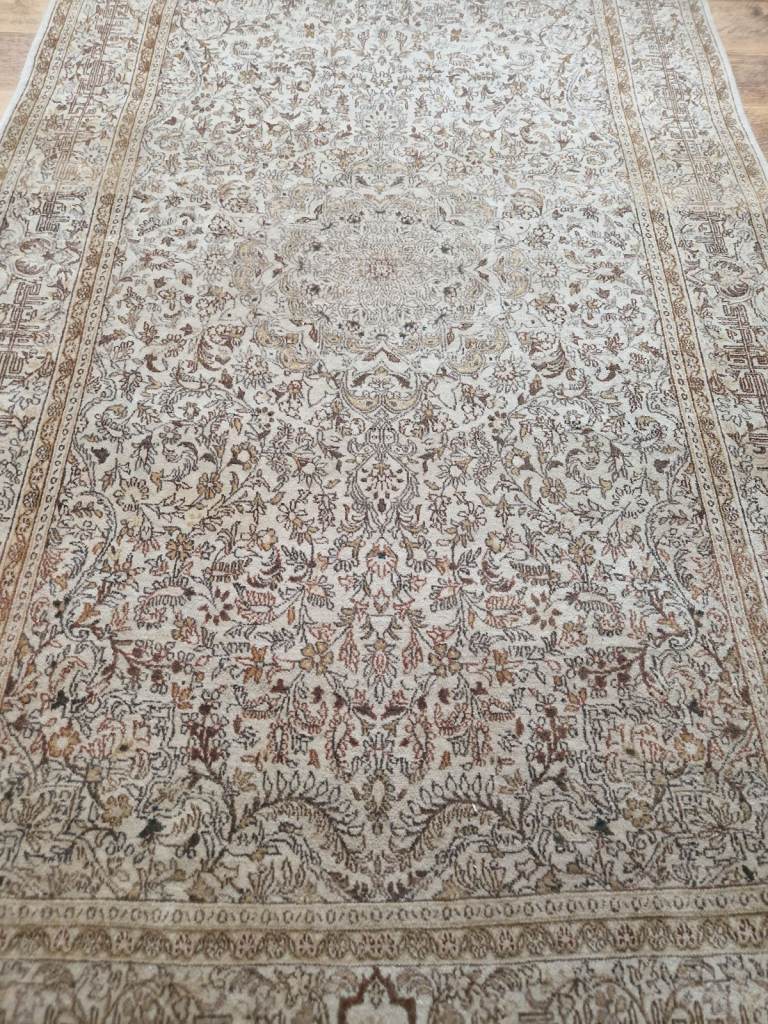 an antique handmade wool persian rug  