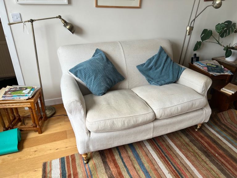 Cosy Beige Fabric Two-Seater Sofa – Good Condition