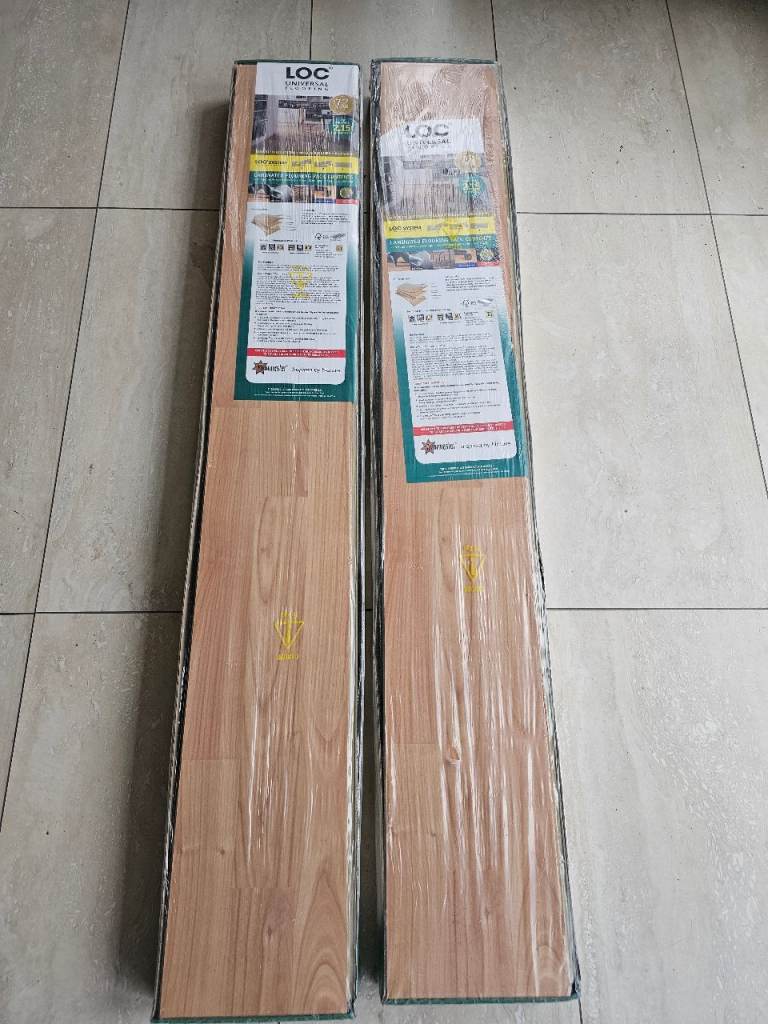 2 unopened packs of laminate flooring 