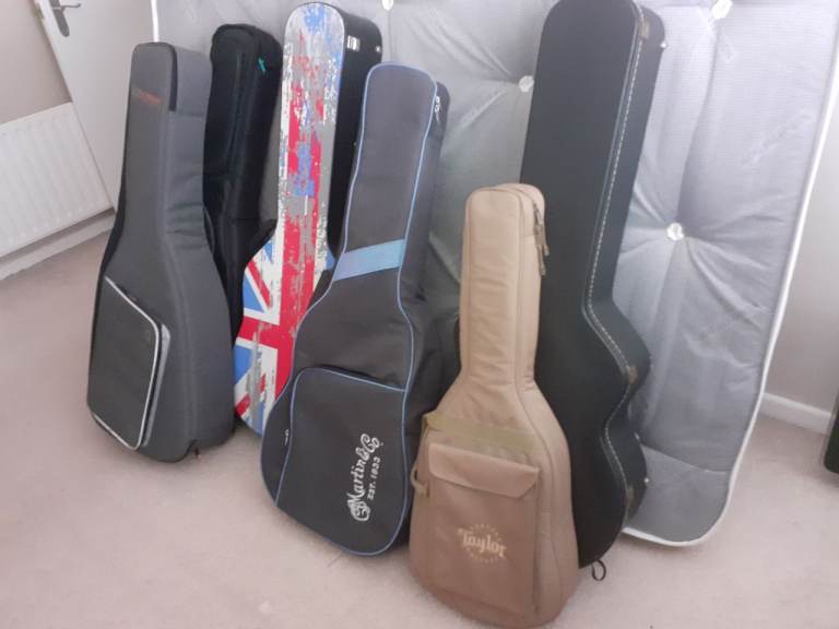 VARIOUS ACOUSTIC GUITAR PADDED BAGS, CASES AND HARD CASES TO SUIT DREADNOUGHT AND JUMBO GUITARS.