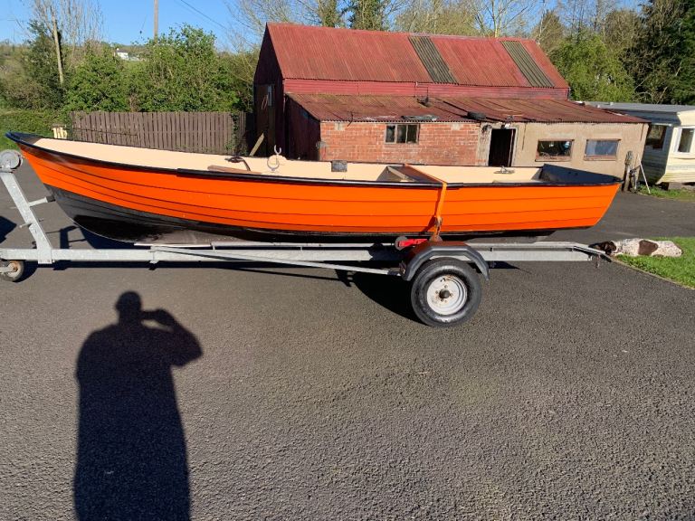 15 ft fiberglass  boat on galvanised trailer 