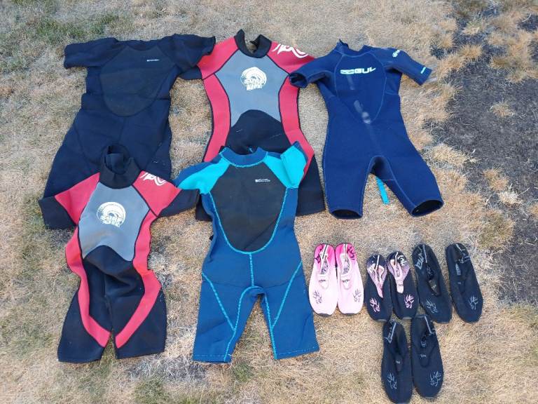 Kids Wetsuits & Water Shoes Bundle – Good Condition
