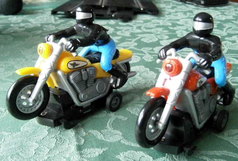 Slot Bikes, like Scalextric, Harley Davidson livery, with light, ? scale.