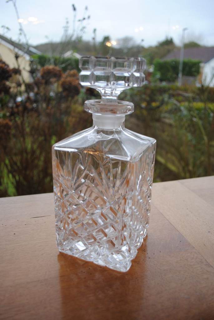 Cut glass crystal decanter with assorted glasses