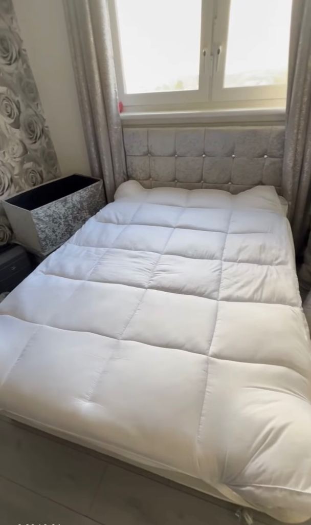 Double bed with mattress topper and ottoman