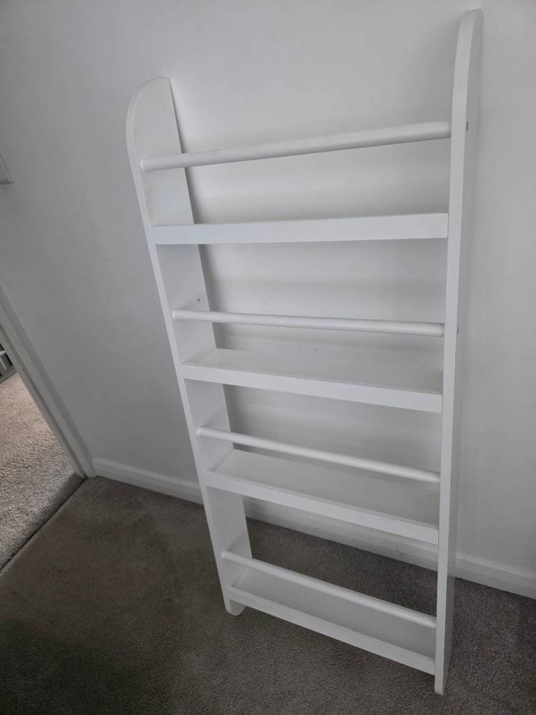 White wall book shelf
