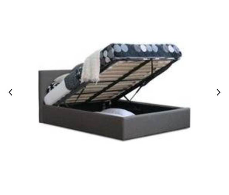 4'6" LIFT UP STORAGE BED WITH RECENT NEW MATTRESS.